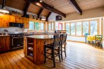 Beautiful, sunny kitchen with island seating and breakfast nook